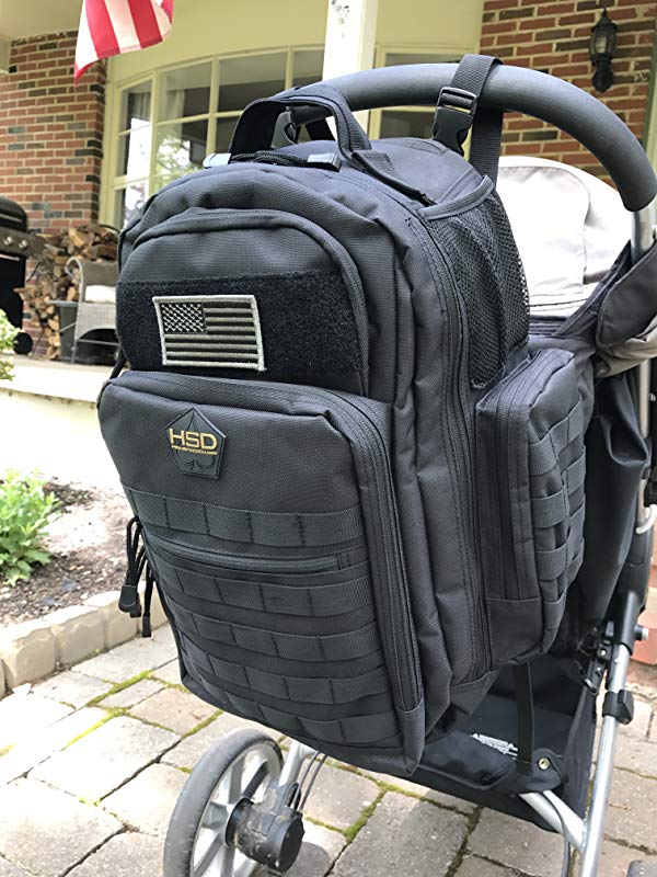 Black tactical backpack attached to a stroller with an American flag patch.