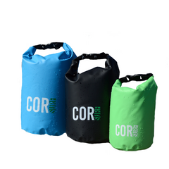 Three COR dry bags in blue, black, and green on a white background