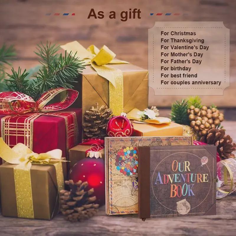 Decorative gift boxes with ribbons and a 'Our Adventure Book' on a wooden surface, surrounded by Christmas decorations.