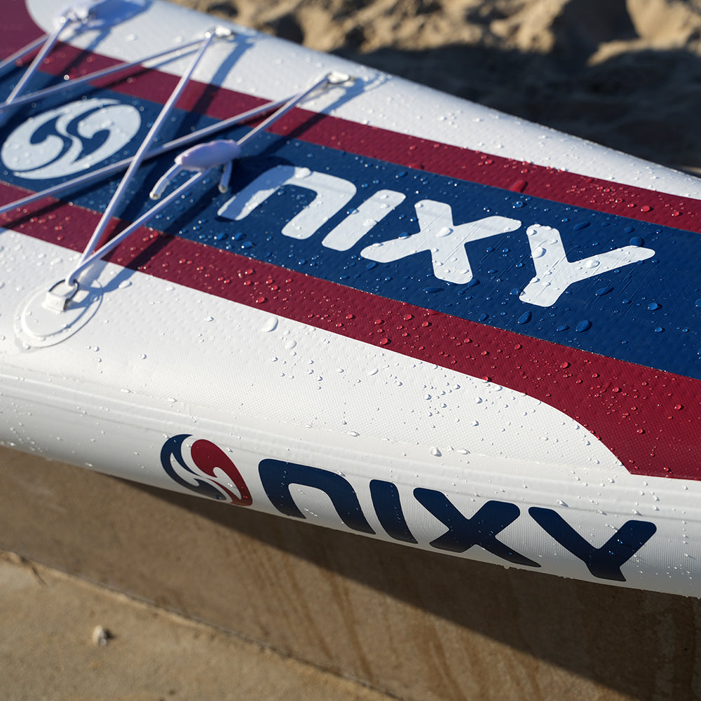 Nixy surfboard on a sandy surface